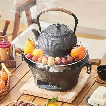 Barbecue - portable - fonte - 23cm - avec - théière - et - fruits - dessus