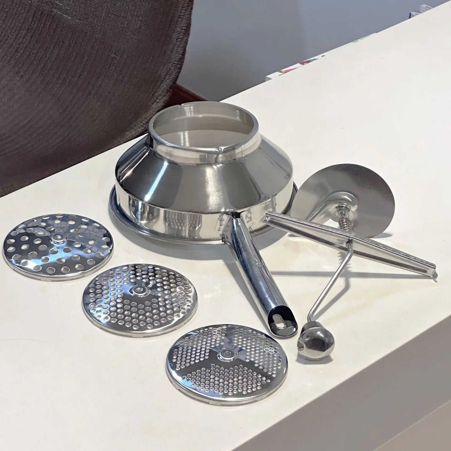Presse-purée - inox - à - spirale - exposer