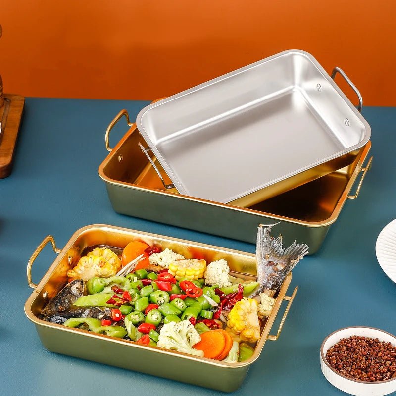 plat à four inox avec poisson et légumes
